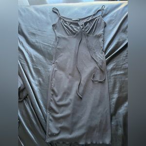 Strapped black bodycon dress.